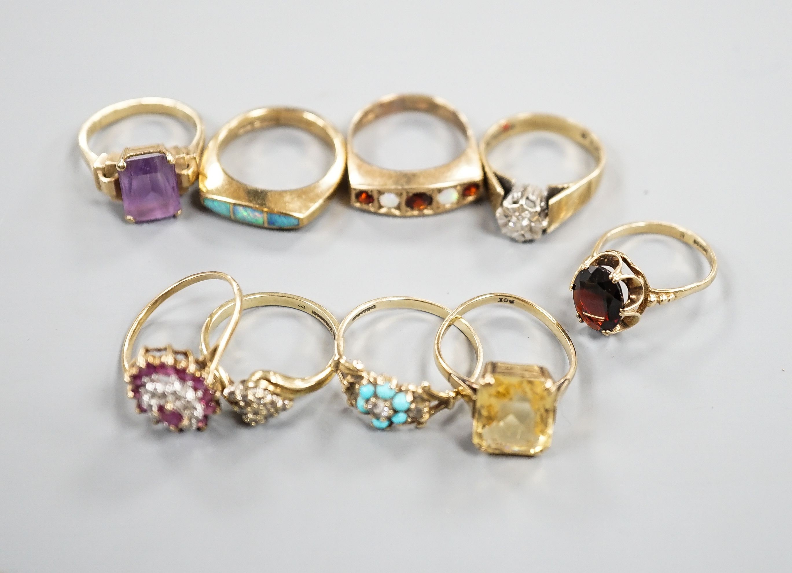 Nine assorted mainly modern 9ct and gem set dress rings, gross weight 29.9 grams.